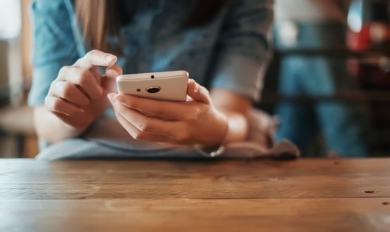 A women interacting with her smartphone